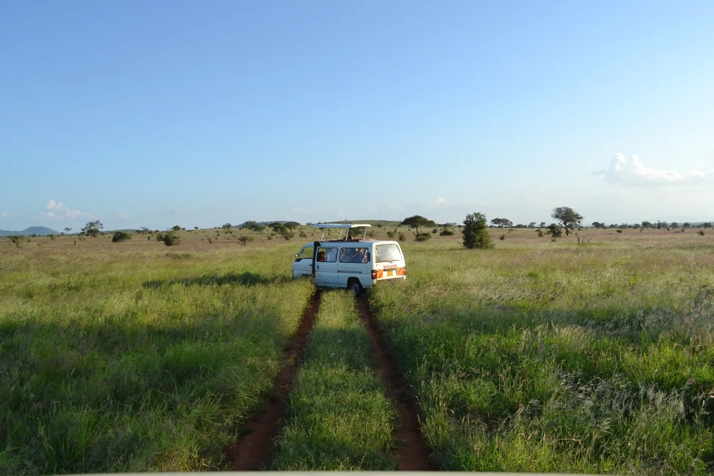 A game-viewer vehicle on a dirt track in Taita Hills, shown as general Kenyan 4x4 context and not as the Aberdare Sapper track.